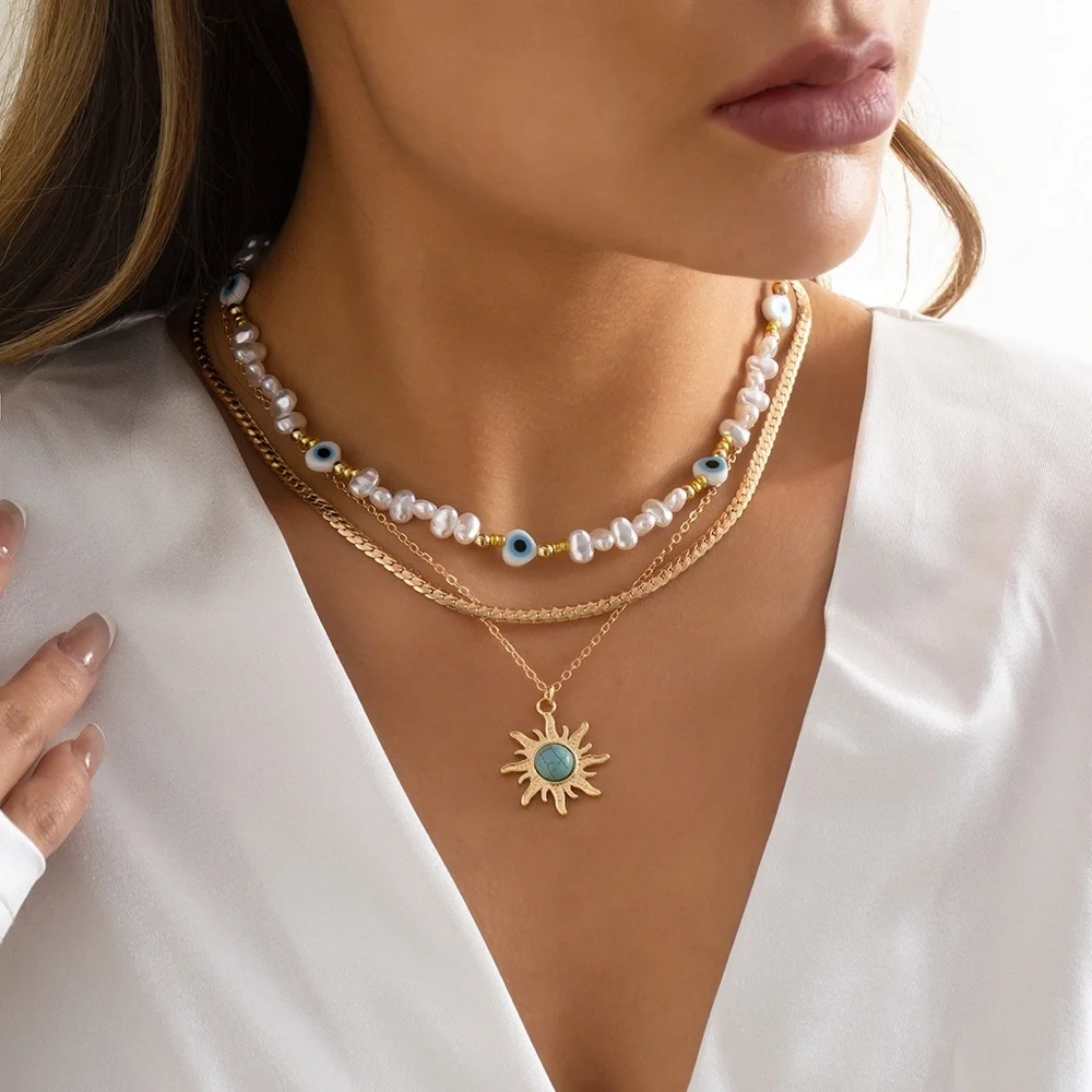 Anthropologie Gold Sun Pendant with White Pearls & Turquoise Accents